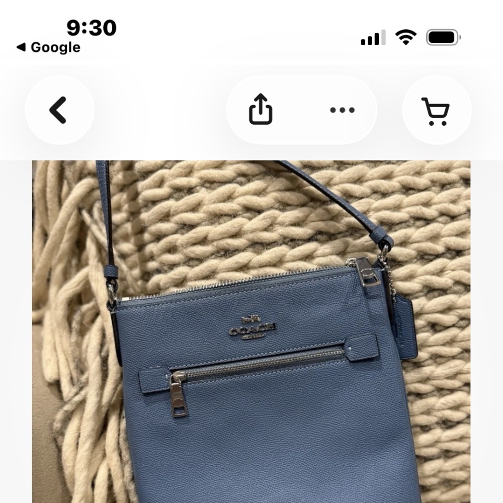 Dooney & Bourke double zippered baby blue crossbody bag.
